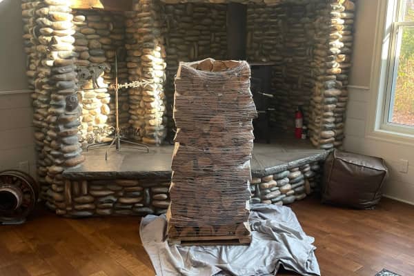 A mini stack of wood, which is how much firewood you need for occasional fireplace fires