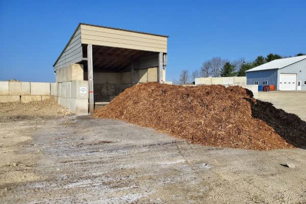 Brown mulch covers a lumber yard
