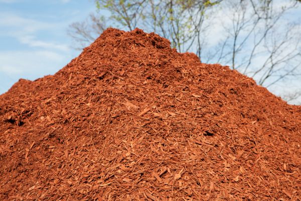 A large pile of red mulch