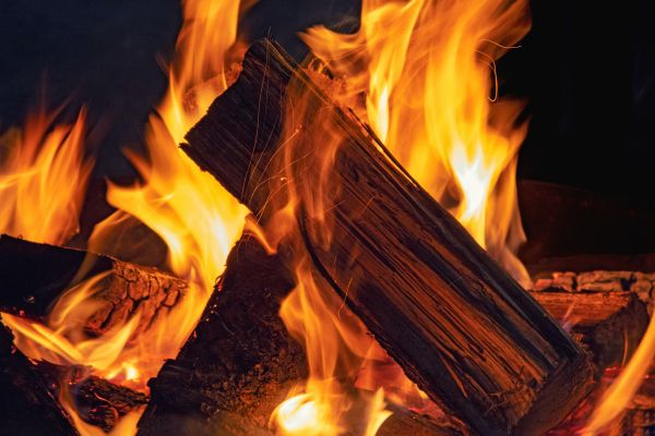 Close-up image of a cozy, blazing campfire created with local firewood for sale