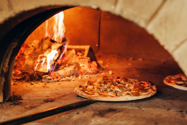 Pizza going in oven for cooking wood faqs blog